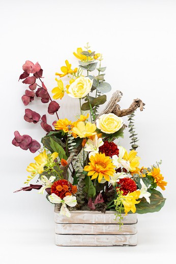 Composition florale artificielle aux couleurs très printanières, orange, jaune et marron. Énergie pure